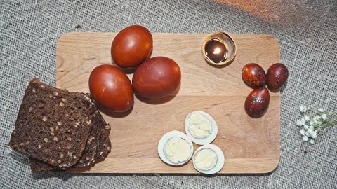 Easter, Easter eggs and bread are on the Board Stock Footage 73455422