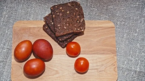 Easter, Easter eggs and broad on wooden Board Video stock 73434964