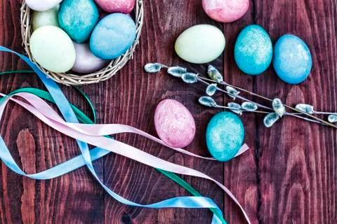 Easter. Easter eggs in a basket, colored ribbons and willow branches, top vie Stockfoto's