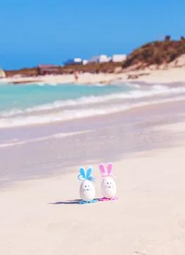 Easter, Easter eggs on the beach, ocean, sea Stock Photos