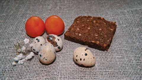 Easter, Easter eggs, bread and tomatoes 스톡 동영상 73418115