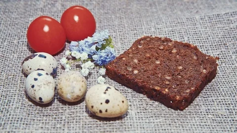 Easter, Easter eggs, bread and tomatoes Video stock 73418566