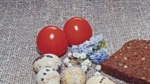 Easter, Easter eggs, bread and tomatoes Stock Footage 73418885