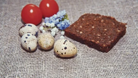 Easter, Easter eggs, bread and tomatoes Stock Footage 73418914
