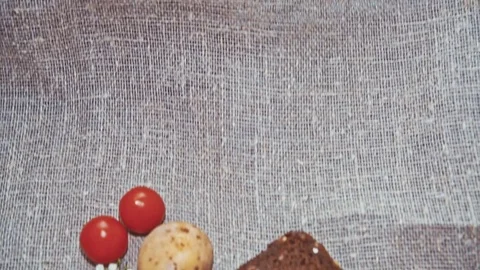 Easter, Easter eggs, bread and tomatoes Video stock 73419785