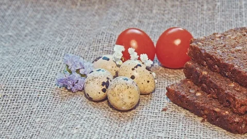 Easter, Easter eggs, bread and tomatoes Stock Footage 73431218