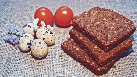Easter, Easter eggs, bread and tomatoes Stock Footage 73431761