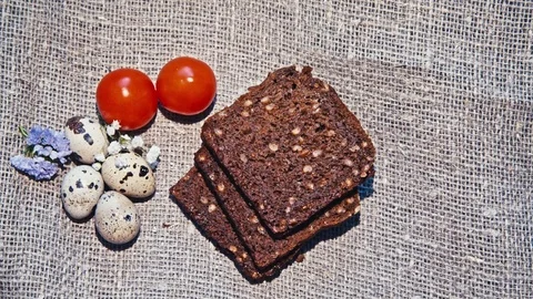 Easter, Easter eggs, bread and tomatoes 動画素材 73432134