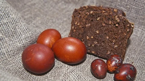 Easter, Easter eggs, bread and flowers Stock Footage 73439825