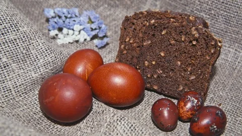 Easter, Easter eggs, bread and flowers Stock Footage 73440081