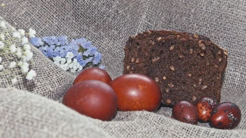 Easter, Easter eggs, bread and flowers Video stock 73440542