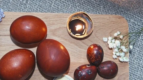 Easter, Easter eggs, candles and flowers Video stock 73438638