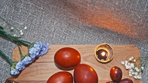 Easter, Easter eggs, potatoes and flowers Stock Footage 73438337