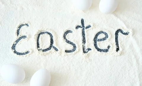 Easter. Easter inscription on flour. Easter theme. Copy space. Stock Photos