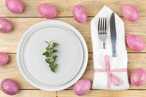 Easter. Easter table setting. Pink Easter eggs and flowers tulips on a natura Stock Photos