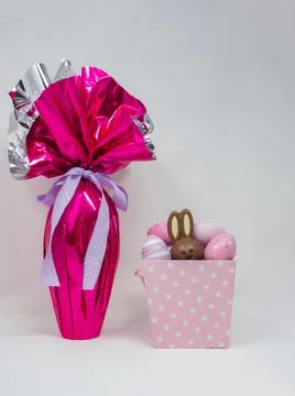 Easter egg and basket with hidden chocolate rabbit Stock Photos