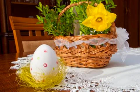 Easter egg and basket on the table Stock Photos