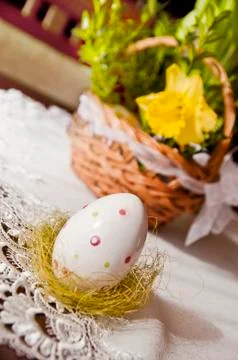 Easter egg and basket on the table Stock Photos
