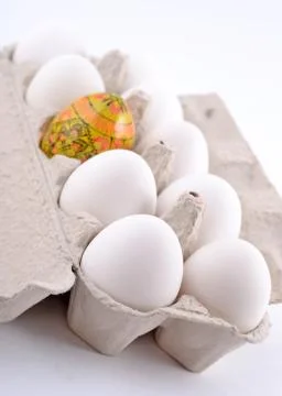 Easter egg and jast eggs in a cardboard box Stock Photos