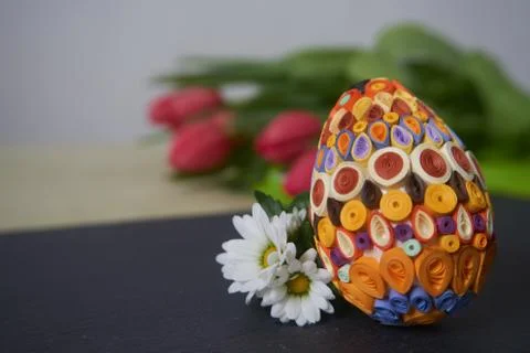 Easter egg and red tulips Stock Photos