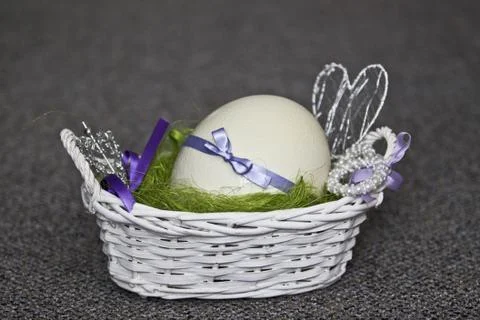 Easter egg in the basket Stock Photos