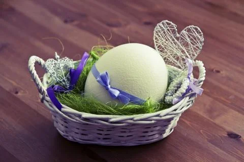 Easter egg in the basket Stock Photos