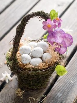 Easter egg in basket, selective focus Stock Photos