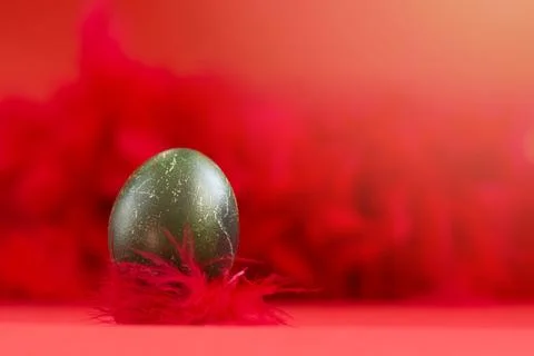 Easter egg in a beautiful dark green color with scratches Stock Photos