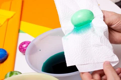 Easter egg is beeing green colored Fotos Stock