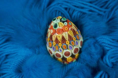 Easter egg on a blue wool scarf Stock Photos