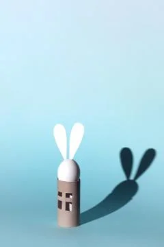 Easter egg bunny on self-insulation. In the toilet paper cabin. A concept on Stock Photos