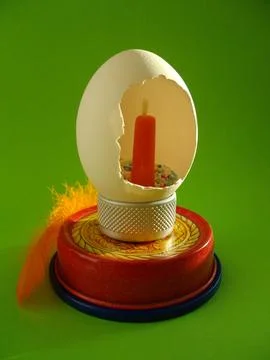 Easter egg with a candle. Stock Photos
