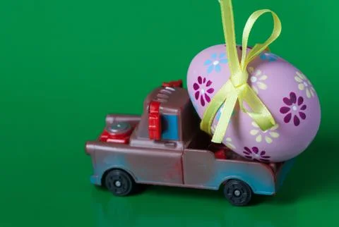 Easter egg on the car a green background Stock Photos