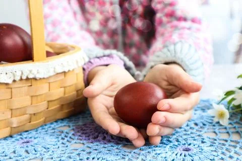 Easter egg in children's hands, close-up, bokeh Stock Photos