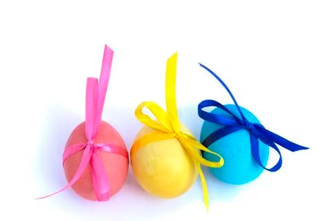 Easter egg with colored ribbons on a white background Foto stock