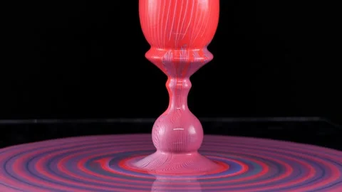 Easter egg in colorful multicolored paint. The egg on the stand turns around its Stock Footage 171632215