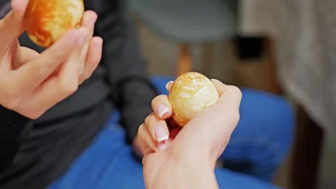 Easter Egg Cracking Tradition In Europe With Hands Sharing Painted Eggs Stock Footage 327774143