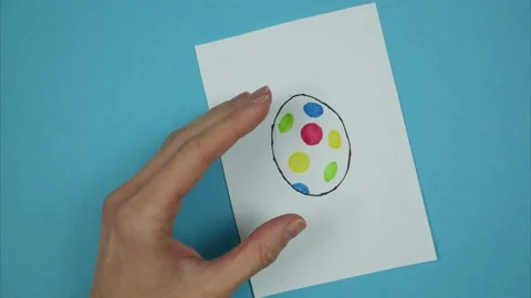 Easter egg drawing transformed into real easter egg. Stop motion animation Video stock 179512630