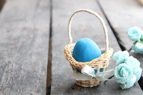 Easter egg Easter egg in basket on rustic table Stock Photos