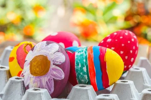 Easter egg in egg box on wood Stock Photos