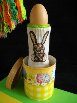 Easter egg with a festive box and an Easter bunny. Stock Photos