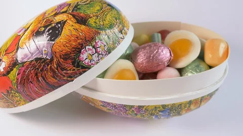Easter egg filled with candy Stock Footage 128986630
