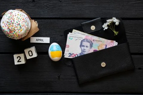 Easter egg with the flag of Ukraine, Easter cake, a 200 hryvnia bill and a .. Stock Photos