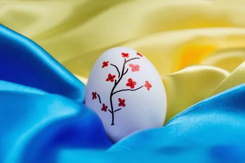 Easter egg on the flag of Ukraine. Stock Photos