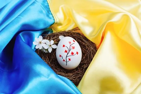 Easter egg on the flag of Ukraine. Stock Photos