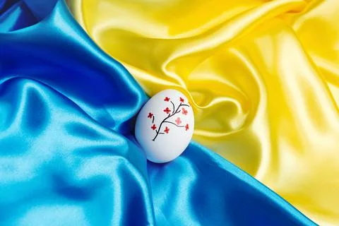 Easter egg on the flag of Ukraine. Stock Photos