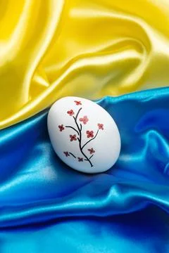 Easter egg on the flag of Ukraine. Stock Photos
