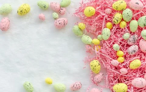 Easter egg frame. Rose, soft pink yellow and green pastel colors on a white Stock Photos