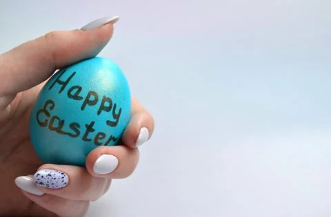 Easter egg in hand, close-up. Happy Easter. Stock Photos