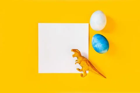 Easter egg hunt holiday composition, paper note or list with colorful eggs Photos